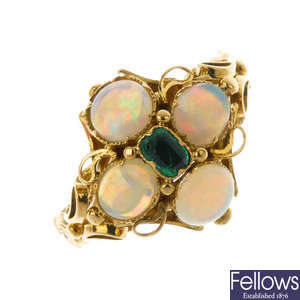 An opal and emerald dress ring.