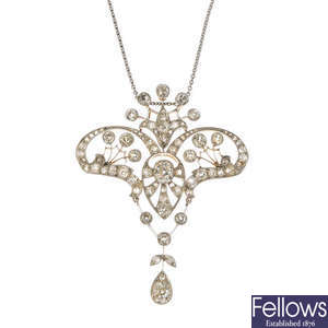 An Edwardian platinum and 18ct gold diamond pendant and chain.