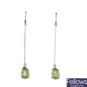 A pair of peridot ear pendants.