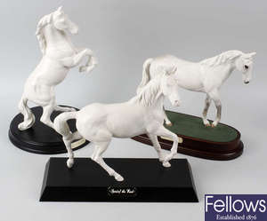 A group of eight Royal Doulton horses.