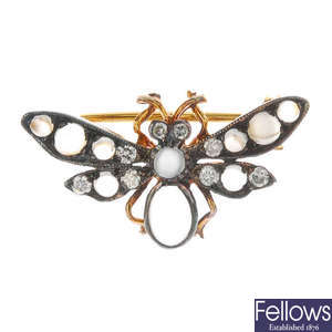 A gem-set fly brooch.