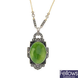 A jade, onyx and diamond pendant.