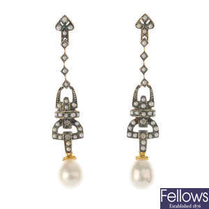A pair of gem-set earrings.