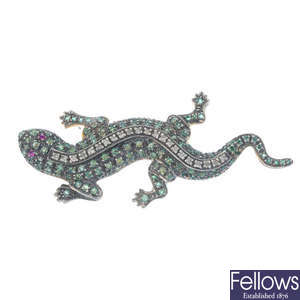 A diamond and gem-set salamander brooch.