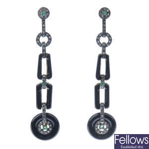 A pair of onyx, emerald and diamond earrings.