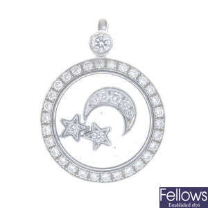 CHOPARD - an 18ct gold star and moon pendant.