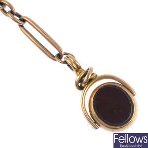 An early 20th century 9ct gold Albert and hardstone swivel fob.