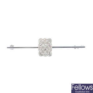 A diamond cluster bar brooch.