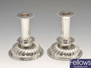 A pair of Victorian silver candlesticks.