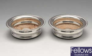 A pair of modern silver mounted coasters.