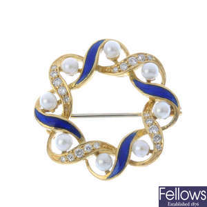 A diamond, seed pearl and enamel wreath brooch.