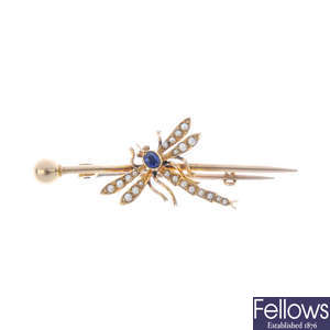 An early 20th century gold sapphire and split pearl dragonfly brooch.