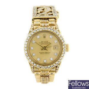 ROLEX - a lady's diamond set 18ct yellow gold Oyster Perpetual Datejust bracelet watch.