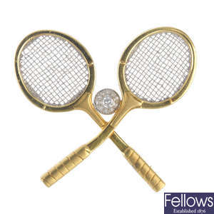 An 18ct gold diamond novelty tennis racquets brooch.