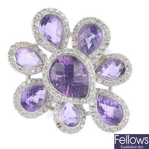 An amethyst and diamond cluster floral dress ring.