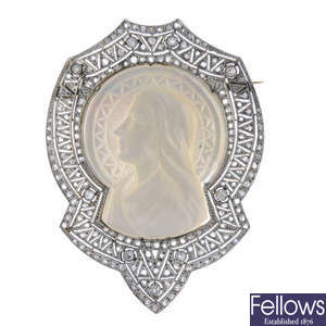 A diamond and mother-of-pearl brooch.