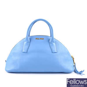 MIU MIU - a blue leather bowling handbag.