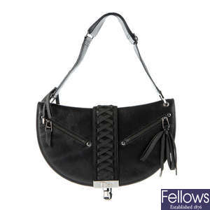 CHRISTIAN DIOR - a black leather braided handbag.