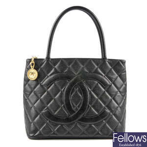 CHANEL - a black quilted caviar leather tote handbag.