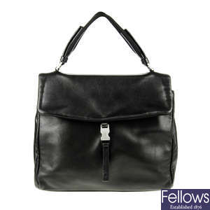 PRADA - a black handbag.
