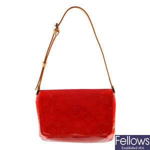 LOUIS VUITTON - a red Monogram Vernis Thompson Street flap handbag.