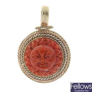 A carved coral pendant.
