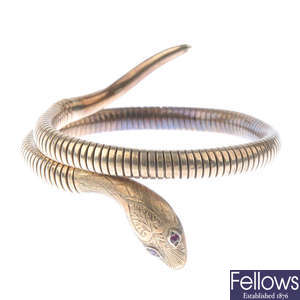 A 1960s 9ct gold snake bangle.