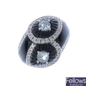 An aquamarine, diamond and onyx dress ring.