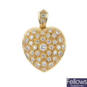 An 18ct gold diamond pendant.