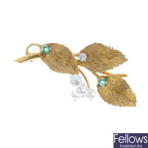 A 1960s 18ct gold emerald, diamond and cultured pearl floral brooch.