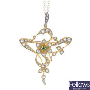 An early 20th century 15ct gold split pearl and demantoid garnet pendant, with 9ct gold chain.