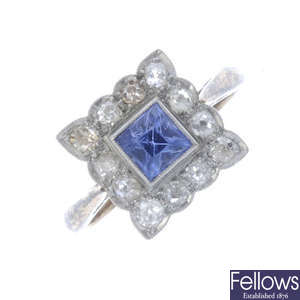 A synthetic sapphire and diamond cluster ring.