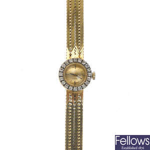OMEGA - a lady's 18ct gold diamond manual wind wristwatch.