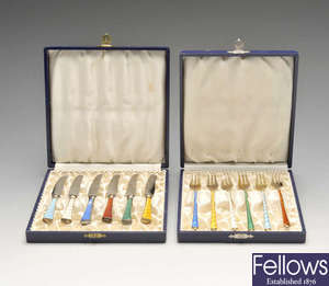 Three cased sets of 1950's Danish import silver-gilt and enamel flatware.