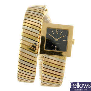 BULGARI - a lady's yellow metal Tubogas bracelet watch.
