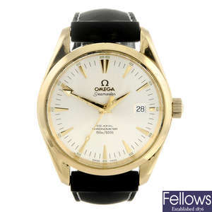 OMEGA - a gentleman's 18ct yellow gold Seamaster Aqua Terra Co-Axial wrist watch.