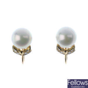 MIKIMOTO - a pair of cultured pearl and diamond earrings.