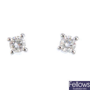 A pair of diamond ear studs and a set of diamond jewellery.