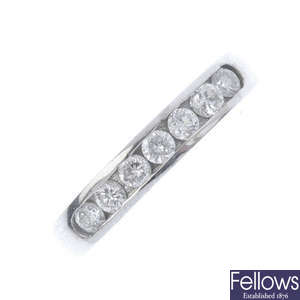 A platinum diamond half-circle eternity ring.