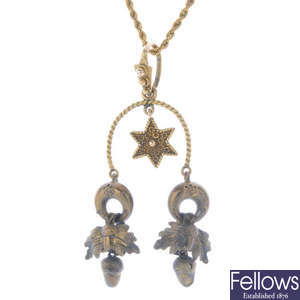 An acorn and star pendant, with chain.
