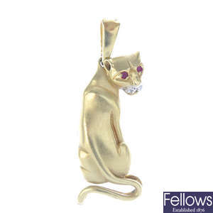 An enamel and gem-set leopard pendant.