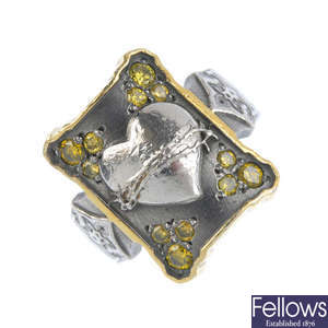 A colour treated 'yellow' diamond dress ring.