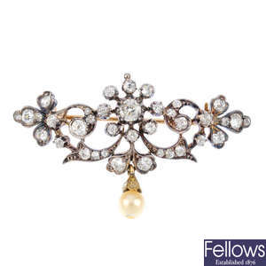 An early 20th century diamond and cultured pearl brooch.