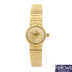 OMEGA - a lady's 18ct yellow gold bracelet watch.