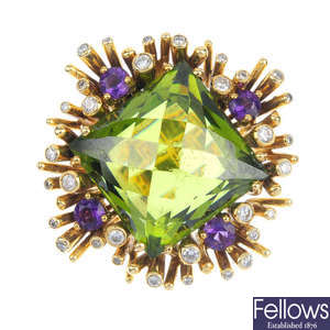 An amethyst, diamond and green cubic zirconia dress ring.