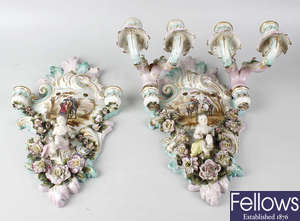 A box containing a pair of Sitzendorf style porcelain wall sconces