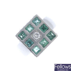 An emerald and diamond dress ring square-shape panel.