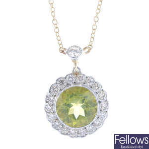 A peridot and diamond cluster necklace.