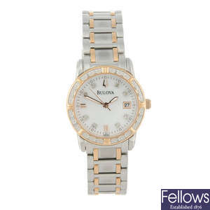 BULOVA - a lady's bi-colour bracelet watch with two other watches.