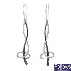 A pair of 18ct gold diamond and black gem earrings.